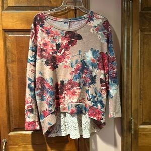 One Story long sleeve top with laced flared back